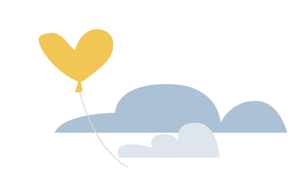 a yellow heart shaped balloon floating passed clouds