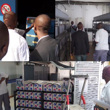 Four tiled images of men unloading machinery in a warehouse.