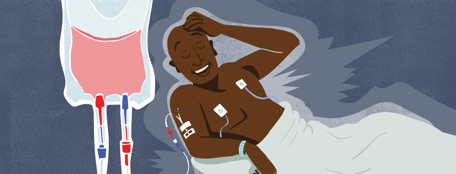 a man undergoing further testing for heart failure is relieved while he sits in a hospital bed with an IV set up.