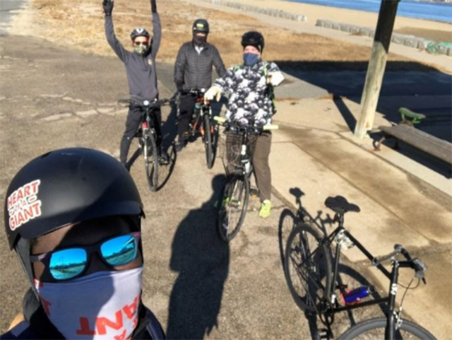 A selfie of four adult cyclists.