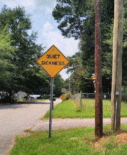 Road sign that says quiet sickness