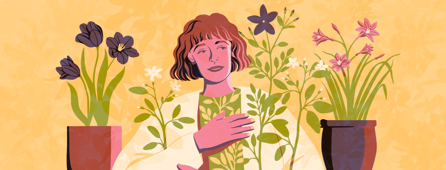 alt=a woman holding her hand over her heart, surrounded by plants and flowers